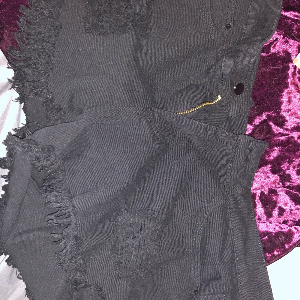 black ripped shorts